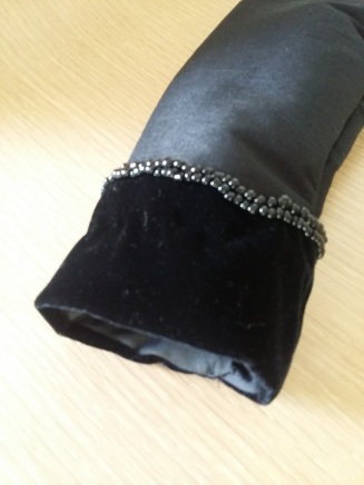 Beading on one of the cuffs